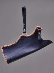 A detailed view of a uniquely designed leather longbow quiver craftsmen. The item showcases...