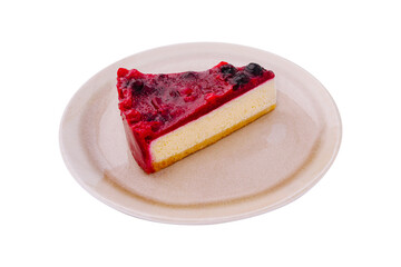 Delicious cheesecake slice with colorful berry topping on a plate