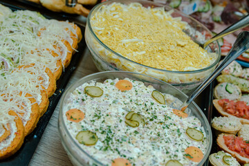 A cold appetizer in the form of salads, pies and various small bites served next to the dish that keeps the meat warm