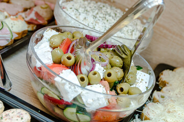 A cold appetizer in the form of salads, pies and various small bites served next to the dish that keeps the meat warm