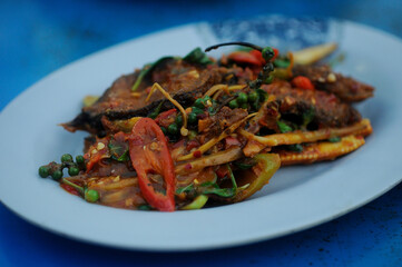Thai style crispy fried tilapia stir-fried with chili paste