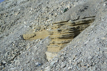 Sandstone is formed when sand grains are compacted over thousands to millions of years, with...