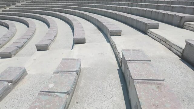 The Odeon in Pogradec, Albania. - June 12, 2025. The city's open theatre incorporates various architectural and landscape elements, such as staircases and fragmented cuboidal forms.