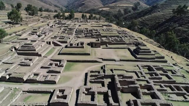 An aerial view captures the ancient inca ruins of pisaq, nestled in the sacred valley of peru, showcasing its rich history and cultural heritage