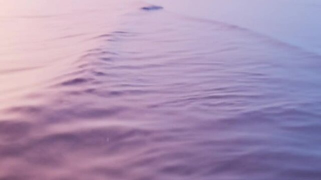 Pastel Wave Rolling Over Reflective Minimalist Surface with Gentle Cinematic Ripples