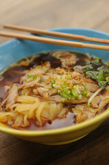 A close up photo of Thai Kway Teow Soup (Thai Noodle soup)