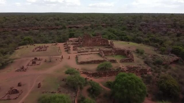 An aerial view of the ancient ruins of gedi, kenya, surrounded by the arabuko sokoke forest and savannah landscape