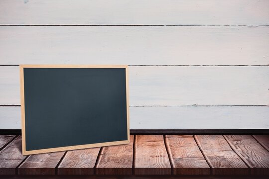 Black board on a wooden table