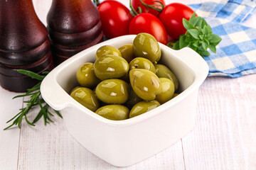 Green marinated olives in the bowl