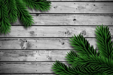 Fir branches on wooden planks