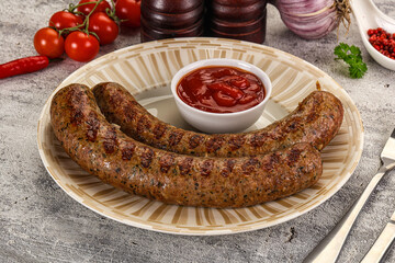 Grilled beef sausages with sauce