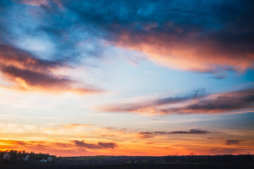 Breathtaking sunset and soft pink clouds of pastel tones.