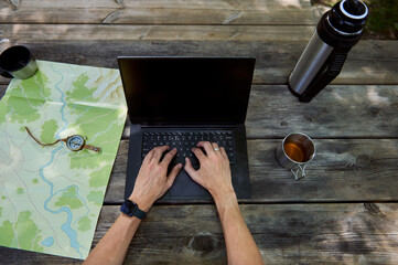 Outdoor Workstation With Map, Compass, and Coffee Among Nature