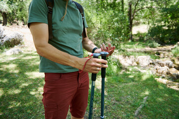 Outdoor Hiker Adjusting Gear During a Woodland Trekking Journey