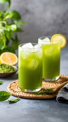 Fototapeta premium Refreshing matcha water, served in a tall glass with ice, garnished with a thin slice of lemon, pure and natural