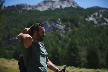 Traveler Hiking in Scenic Mountain Landscape in Summer