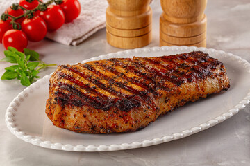 Grilled pork steak with bone