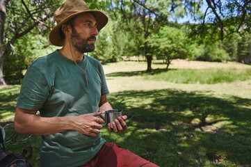 Bearded Traveler Enjoying A Mountain Camp Amidst Summer Nature