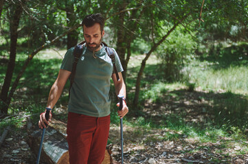 Bearded Man Enjoys an Active Hiking Adventure in the Forest