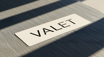Valet Sign Placed Neatly on Wooden Surface with Elegant Shadows Creates Impression
