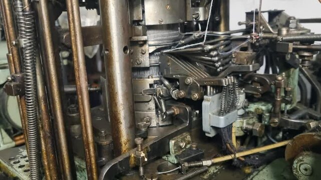 Close-up of a dusty cam drum from a 1950s sock knitting machine, once a key component in Yugoslavia&rsquo;s textile industry, captured while in motion