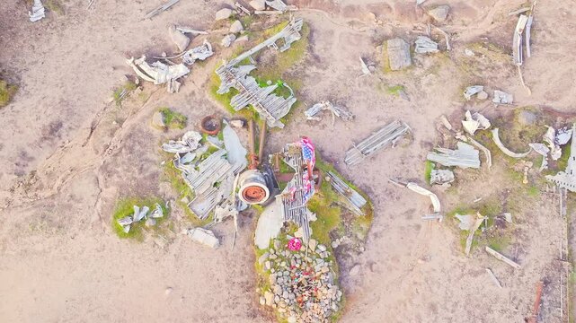 Top-down over 1948 B-29 Superfortress plane crash site in the Peak District, England, revealing stone memorial and waving American flag above wreckage site.