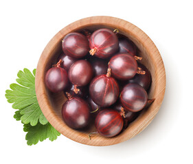 Gooseberries in a wooden plate with leaves on a white background. Top view