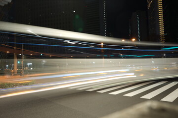 Night City Lights Abstract Motion Blur of Urban Traffic and Crosswalk
