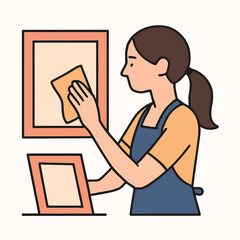 Woman Cleaning Picture Frames At Home