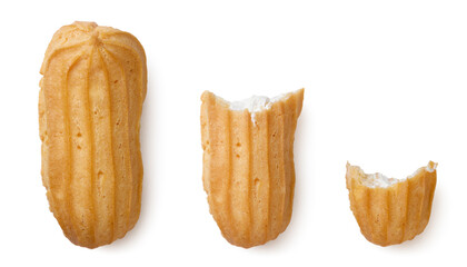 Set of eclairs and two pieces close-up on a white. Top view