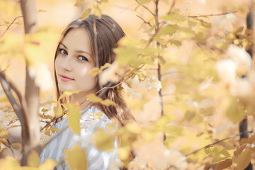 Fototapeta premium Young girl on a walk in the autumn