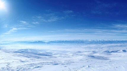 Obraz premium The breathtaking winter landscape under a clear blue sky and shining sun.