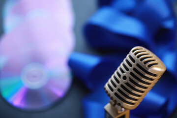 The concept of media presentations. Retro microphone on the background. Concert and show poster....