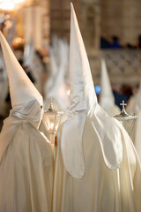 Unrecognizable Nazarenes during Spanish holly week celebration. High quality photo