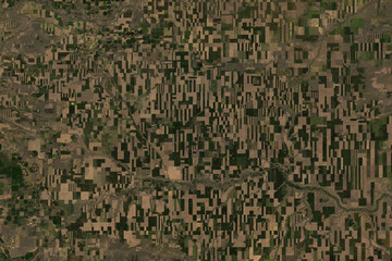Satellite image of agricultural structures in Montana near Conrad - contains modified USGS/NASA Landsat Data (2025)