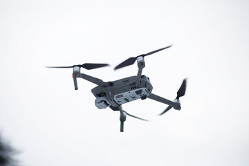 Copter in flight. Drone against the sky.