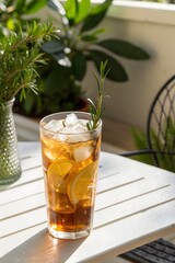 Refreshing iced tea with lemon slices served in a cozy outdoor setting on a sunny afternoon