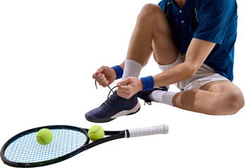 Male tennis player sitting on court floor and tying shoelaces before practice session. Isolated on...
