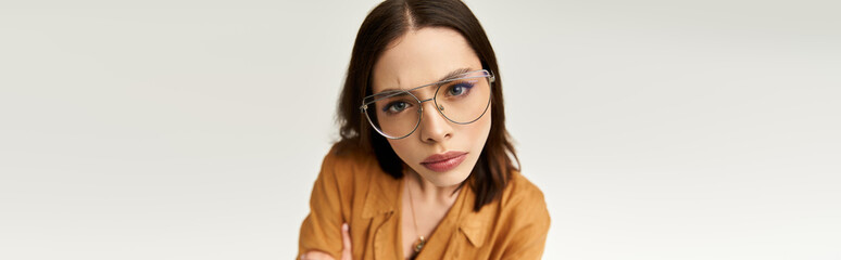 Stylish woman showcases vibrant fashion in urban setting while exuding confidence and grace