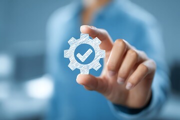 High quality photo of person holding a stylized gear with a checkmark symbolizing successful process or approval.