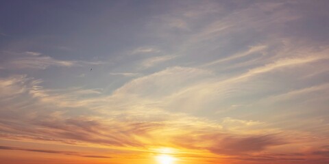 Beautiful sunset sky with clouds and sun rays. Nature background.