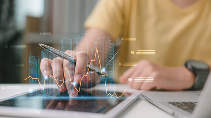 Real estate agent analyzing property market with digital graph overlay on tablet. Concept of smart property investment, housing market trend, and digital real estate strategy.