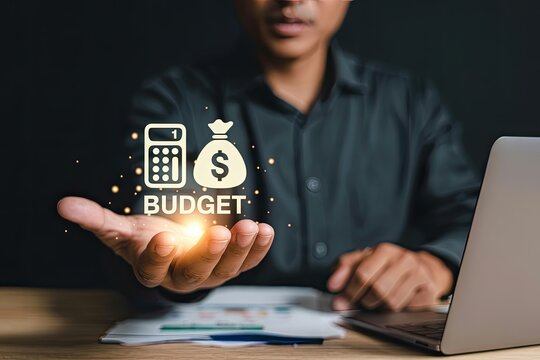 Man holding a glowing budget icon with a calculator and money bag symbolizing financial planning and wealth management