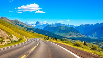 Naklejka premium The asphalt road goes deep into the mountains under a bright blue sky. An ideal image for the themes of travel, tourism and freedom. The landscape inspires calm and a desire for the road.