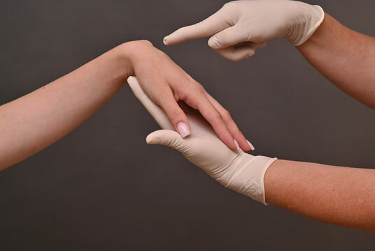 Wrist ganglion cyst appears as soft swelling on joint. doctor examines and examines cyst treatment. filled ganglion around wrist joint. hygroma on arm or cyst requires treatment.