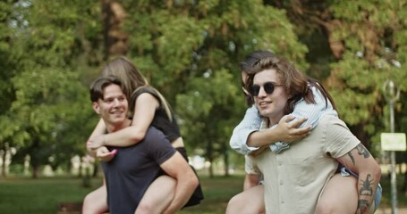 Groups of young, carefree friends enjoying playful piggyback rides in a sunny park. Capturing genuine happiness, laughter, and strong bonds during a summer day. - Powered by Adobe
