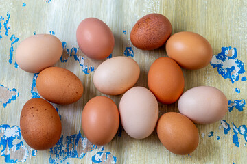 Fresh eggs displayed on rustic wooden background