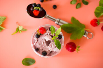 Homemade berry ice cream on pink background