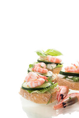 Light festive canapes with seafood, greens and fresh vegetables