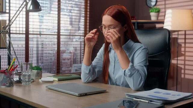 Caucasian tired overworked businesswoman finishing work closing laptop take off glasses relief eyes discomfort business woman female girl in office complete work done job stress fatigue exhausted